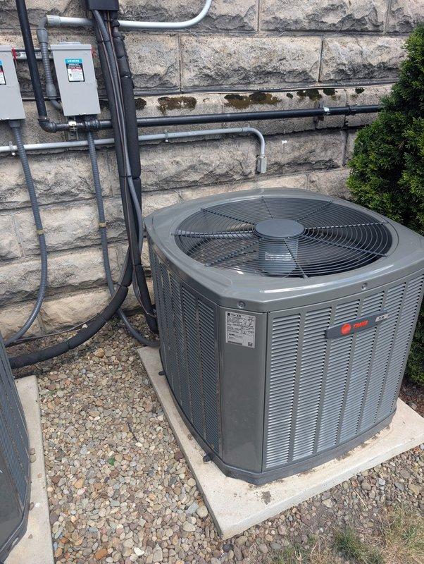 Replaced failed compressor on commercial air conditioning condenser unit under parts warranty coverage. Removed defective compressor, brazed refrigerant line connections closed to return for warranty claim, and installed new compressor with proper refrigerant line connections. System tested and operational upon completion.