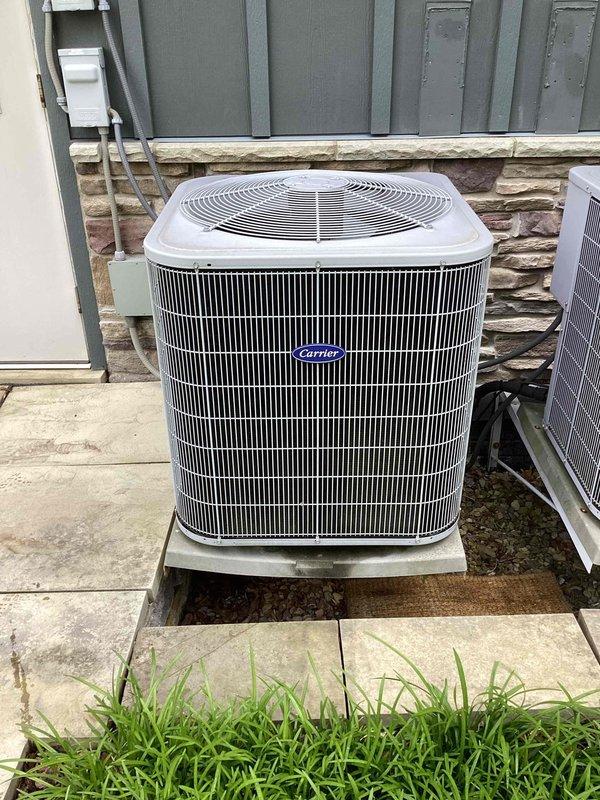 Completed scheduled commercial cooling maintenance visit on Carrier air conditioning system. Performed comprehensive inspection of outdoor condenser unit, verified electrical connections at disconnect panel including capacitor and contactor assembly, and documented equipment condition through photographic records. All components found operating within normal parameters with no immediate service requirements identified.