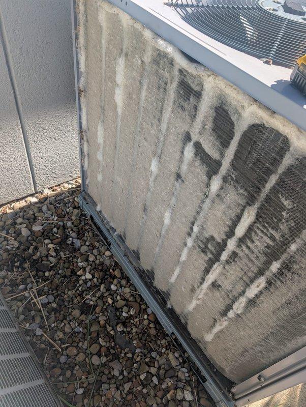 Performed comprehensive tune-up and cleaning service on multiple rooftop air conditioning systems. Thoroughly cleaned heavily soiled evaporator coils showing significant dust and debris accumulation with visible dark streaking and contamination throughout fin surfaces. Cleaned exterior condenser unit coils exhibiting substantial dirt buildup and darkened fin sections. Documented filter sizes for all units as requested and completed full system inspection to ensure proper operation of all air conditioning equipment.