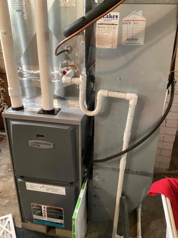 Completed comprehensive maintenance tune-up on 8-year-old residential air conditioning system. Performed standard preventive maintenance procedures including inspection of Armstrong Air furnace and cooling components, verified proper airflow through 16x25x1 pleated air filter, and documented equipment condition through photographic records. All system components found operating within normal parameters with no immediate service concerns identified.