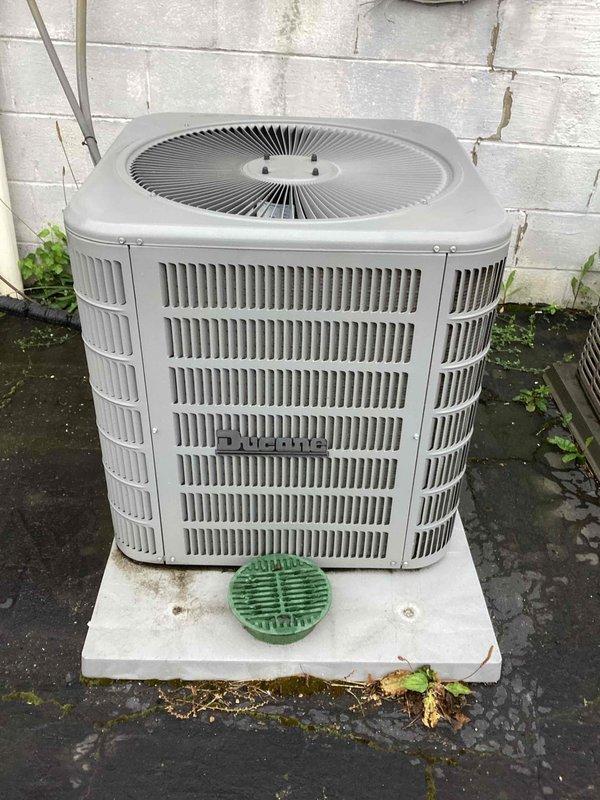 Completed scheduled commercial cooling maintenance visit on rooftop package unit. Performed comprehensive inspection of outdoor condenser unit, verifying proper operation of cylindrical fan assembly and adequate airflow through perimeter vents. Confirmed unit is properly mounted on concrete pad with functional condensate drainage system. Inspected HVAC ductwork components including insulated sections and verified proper labeling and installation integrity. Unit operating within normal parameters with no immediate service needs identified. All equipment showing typical weathering consistent with outdoor installation and regular use.