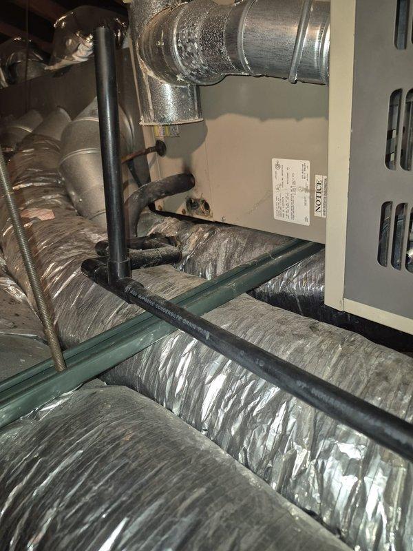 Completed scheduled maintenance on residential air conditioning system over 10 years old. Performed standard tune-up procedures including inspection of HVAC unit, ductwork, and refrigerant lines in attic space. Identified condensate drain line requiring replacement and documented condition with photos for customer review and future service planning.