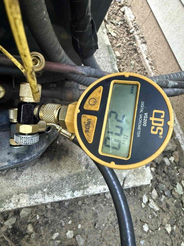 Responded to service call for air conditioning unit disconnect at residential property. Upon arrival, coordinated with homeowner to access outdoor AC unit located on patio area. Performed system evacuation using CPS VC200 digital vacuum gauge, achieving proper vacuum levels at 5.7 microns to safely recover refrigerant from the system. Inspection revealed significant corrosion and rust on refrigerant line connections, copper piping joints, and associated hardware, indicating prolonged exposure to outdoor elements and moisture. Successfully disconnected refrigerant lines, electrical connections, and conduit from outdoor condensing unit. All refrigerant was properly recovered in accordance with EPA regulations. Documented existing equipment condition showing deteriorated connections and weathered components on concrete pad. Unit disconnection completed as requested.