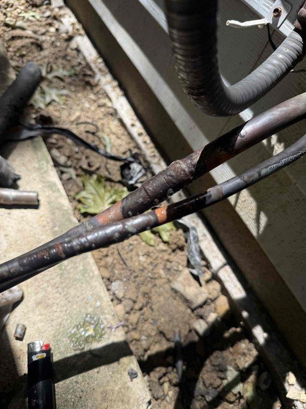 Responded to service call for air conditioning unit disconnect at residential property. Upon arrival, coordinated with homeowner to access outdoor AC unit located on patio area. Performed system evacuation using CPS VC200 digital vacuum gauge, achieving proper vacuum levels at 5.7 microns to safely recover refrigerant from the system. Inspection revealed significant corrosion and rust on refrigerant line connections, copper piping joints, and associated hardware, indicating prolonged exposure to outdoor elements and moisture. Successfully disconnected refrigerant lines, electrical connections, and conduit from outdoor condensing unit. All refrigerant was properly recovered in accordance with EPA regulations. Documented existing equipment condition showing deteriorated connections and weathered components on concrete pad. Unit disconnection completed as requested.