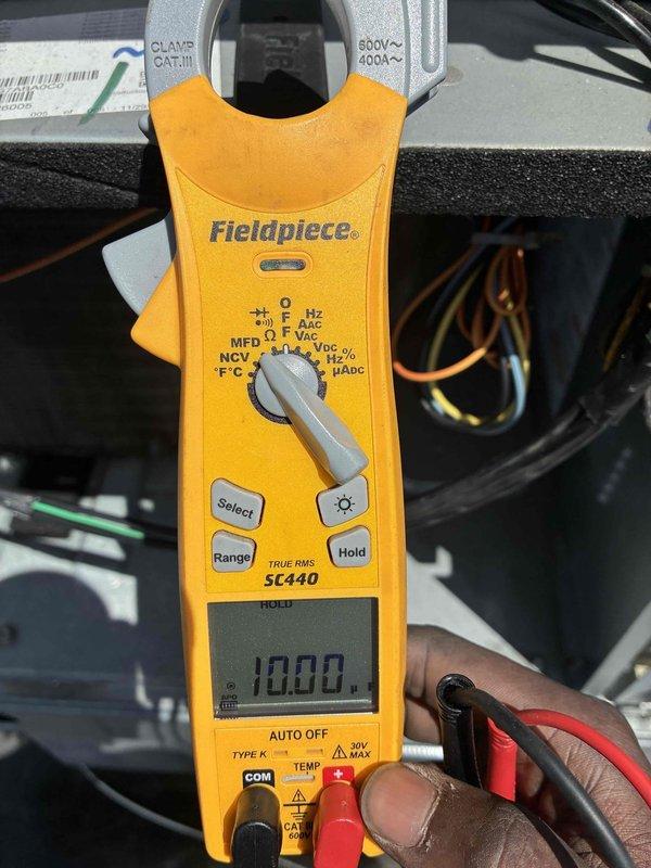 Completed spring maintenance on commercial HVAC unit. Performed comprehensive system inspection including electrical testing with clamp meter, verifying voltage and amperage readings within normal operating parameters. Inspected condenser coil fins and blower assembly, confirming proper operation and airflow. All components functioning as designed with no deficiencies noted. Unit operational and ready for cooling season.