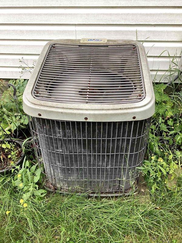 Completed spring maintenance on residential cooling system. Installed new Filtrete 1550 air filter (16x25x4) in HVAC system, noting significant deterioration and rust on metal filter housing that will require monitoring. Inspected outdoor Emerson condenser unit and observed excessive vegetation growth around base restricting airflow. Cleared grass and weeds from perimeter of unit to restore proper ventilation and prevent potential efficiency loss or compressor damage. Condenser housing showed weathering consistent with age but unit operational. Recommended ongoing vegetation management around outdoor unit and future assessment of corroded filter compartment housing for potential replacement to prevent air quality issues and maintain system integrity.