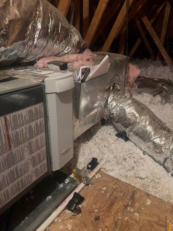 Completed AC retrofit installation in attic space, including new air handler unit with evaporator coil. Installed and connected all necessary ductwork, PVC condensate drainage lines, electrical connections, and flexible conduit. System was properly positioned on attic floor with all components secured and operational per manufacturer specifications.