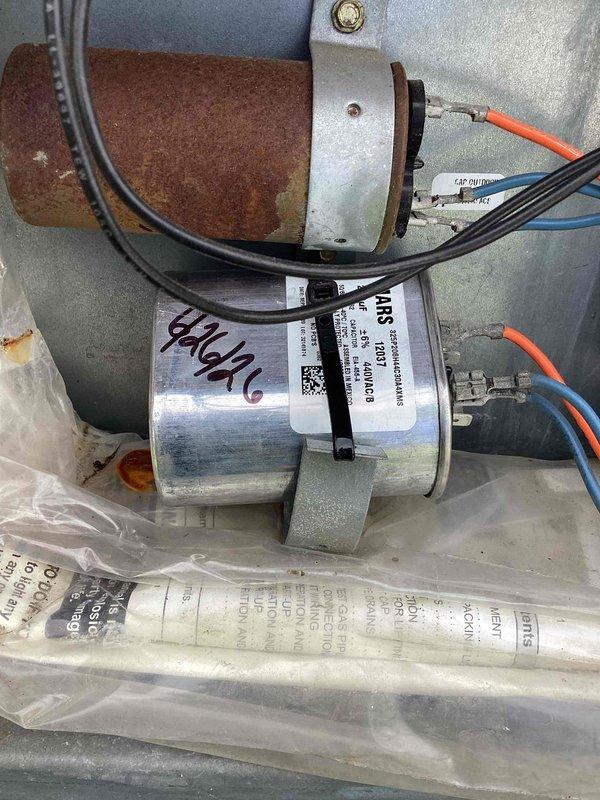 Completed spring maintenance on commercial rooftop HVAC unit. Performed comprehensive system inspection including electrical connections, capacitor evaluation, and ductwork assessment. Documented equipment conditions with rooftop measurements and component photography showing normal operational wear on piping and connections.