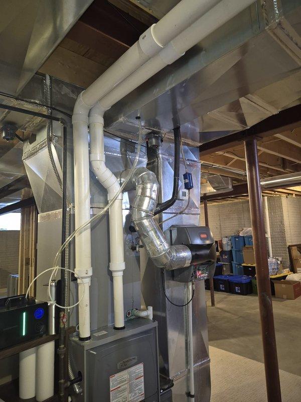 Responded to callback for AC system not cooling properly with persistent knocking noise. Upon arrival, inspected HVAC system including air handler unit, ductwork, and associated piping in mechanical room. Identified and addressed mechanical issue causing abnormal operational sounds. Verified condensate drain lines and PVC piping connections for proper function. Tested system operation and confirmed resolution of knocking noise and restored normal cooling performance.