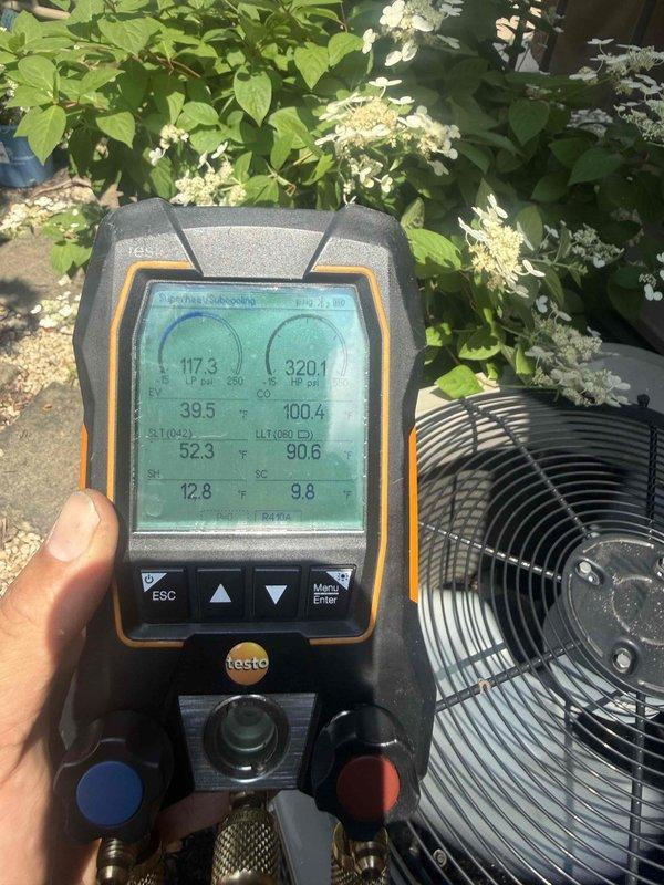 Performed seasonal tune-up on residential air conditioning system, including system diagnostics with digital manifold gauges showing refrigerant pressures and temperatures within acceptable ranges. Identified heavily soiled condenser coil with significant dirt and debris accumulation restricting airflow, requiring thorough cleaning for optimal heat transfer efficiency. Customer reported concerns regarding zoning system operation that will require follow-up evaluation by technician with advanced zoning system expertise.