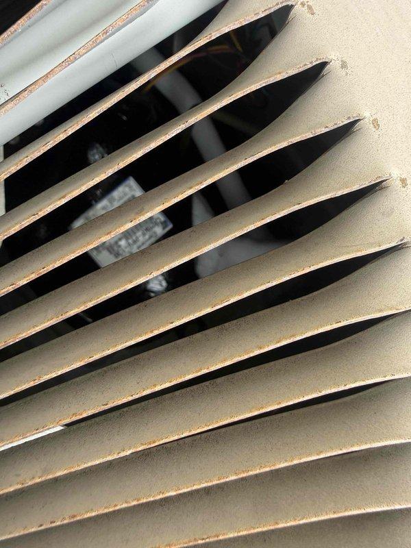 Responded to emergency no-cooling call and performed diagnostic inspection of air conditioning system. Upon arrival, conducted visual assessment of ductwork and ventilation components, documenting interior condition of supply duct system and return air grille. Inspection revealed aged HVAC infrastructure with visible wear on ventilation components and dust accumulation within ductwork, indicating system has been in service for extended period without recent maintenance. Photographed blower assembly and air distribution pathways to document current system condition for service records.