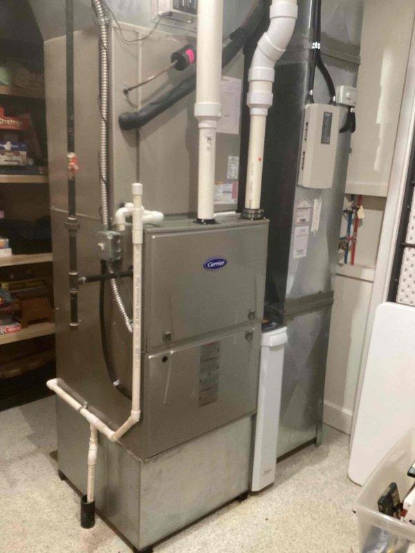 Completed routine maintenance on a 10+ year old residential Carrier cooling system. Performed standard inspection of indoor furnace unit and outdoor condenser, checked all electrical connections, verified proper operation of compressor and fan motor, and ensured condensate drain lines were clear and functioning properly.
