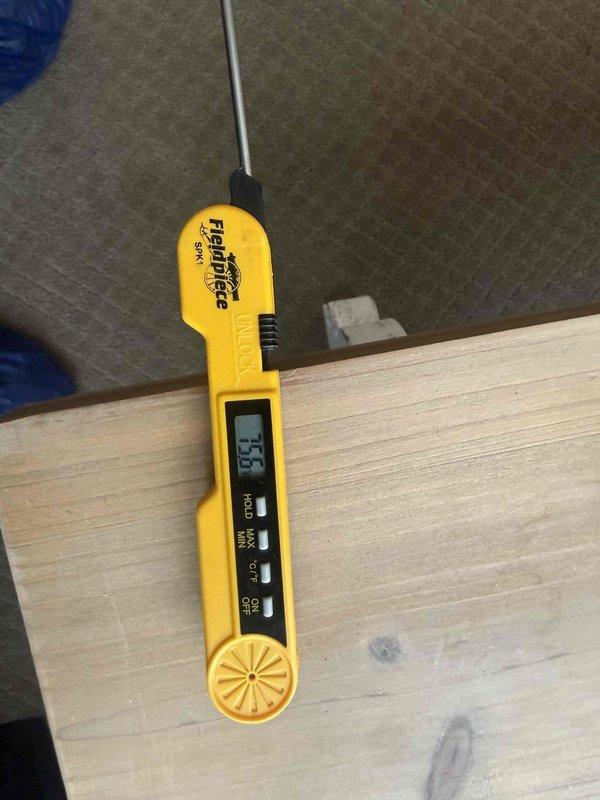 Responded to service call for air conditioning system installed 9 months prior that was struggling to maintain temperature during hot weather. Performed diagnostic testing using digital temperature probes to measure supply air temperatures at register and return air temperatures to assess system performance and cooling capacity. Based on temperature differential readings of 85°F, identified inadequate cooling output indicating potential issues with refrigerant charge, airflow restriction, or system sizing relative to cooling load demands.