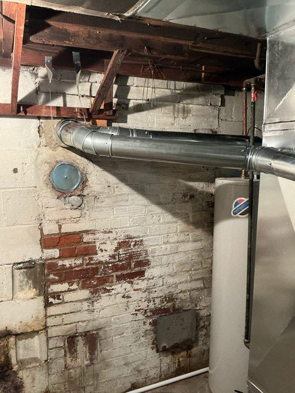 Completed full HVAC system retrofit in basement mechanical room, installing new Lennox furnace with complete ductwork modifications. Installed new refrigerant line set and connected all supply and return ductwork to existing distribution system. System tested and operational.