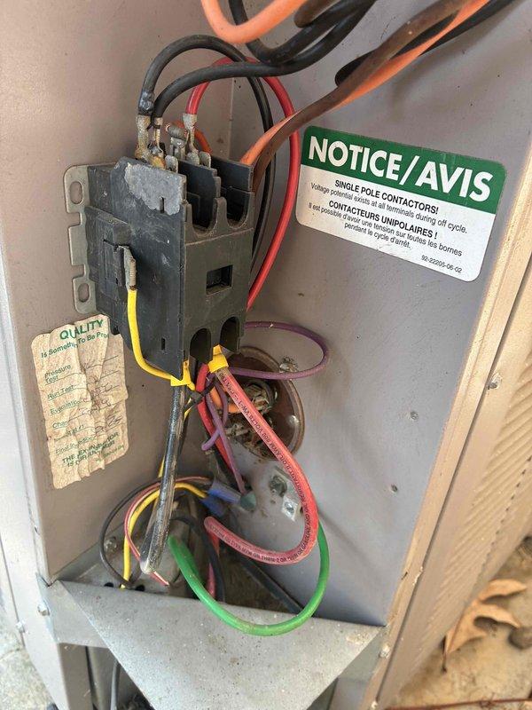 Responded to service call for commercial A/C unit experiencing freeze-up condition. Upon arrival, instructed occupant to turn system off to allow coil to thaw. Performed clean and check procedure on equipment, inspecting electrical panel components, contactors, and control wiring. Documented filter sizes for replacement and photographed electrical panel configuration and exterior conduit routing for service records.