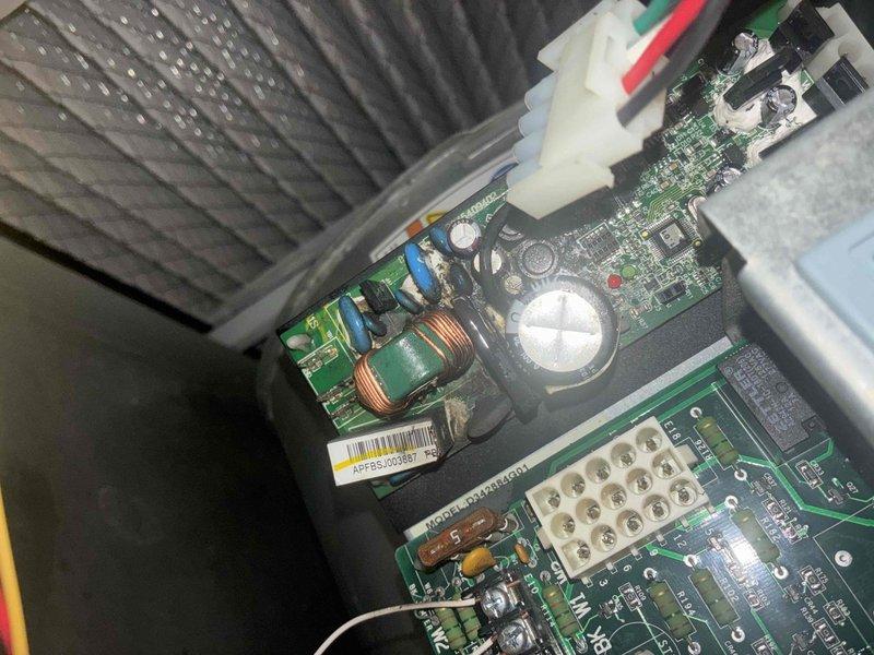 Responded to emergency no-start condition following tripped breaker. Upon inspection, diagnosed failed control board with visible component damage on PCB. Inspected circuit board assembly, toroidal inductors, capacitors, and integrated circuits within control cabinet. Verified system would not initialize after breaker reset due to control board failure. Documented control board serial number APPBS2003681 and LCD display error code for equipment records and recommended complete control board replacement to restore system operation.