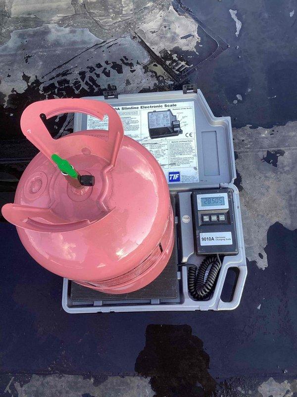 Responded to no cooling complaint on rooftop unit. Found system low on refrigerant charge. Recovered remaining refrigerant using recovery cylinder and electronic scale, then performed leak detection with electronic leak detector. Identified leak source, completed necessary repairs, evacuated system, and recharged unit to manufacturer specifications.