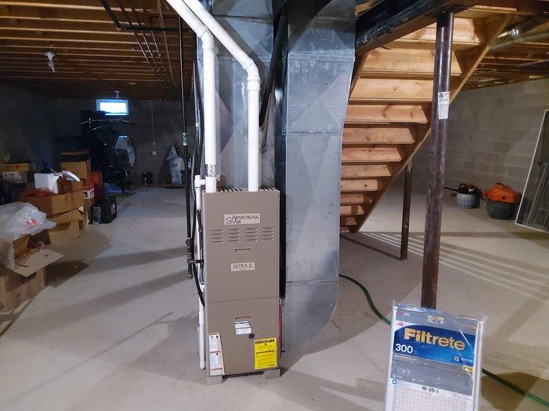 Completed comprehensive estimate for full HVAC system replacement in residential basement installation. Assessed existing furnace and air conditioning equipment configuration, evaluated current ductwork infrastructure including main trunk line, and documented mechanical room layout with water heater proximity. Provided detailed replacement specifications for new high-efficiency heating and cooling system retrofit to upgrade aging equipment while maintaining existing duct distribution network.