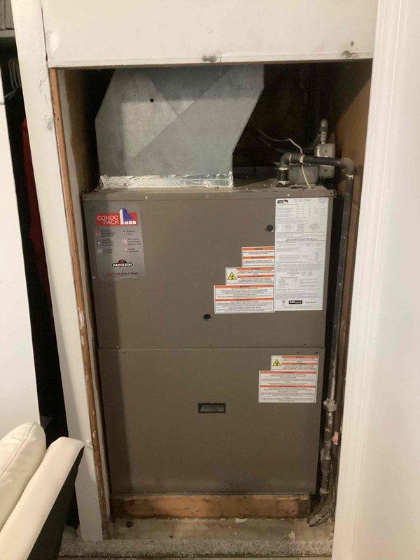 Performed comprehensive tune-up inspection on Goodman dual HVAC system including both furnace and air conditioning components. Inspected unit installed in recessed closet alcove, verified all manufacturer labels and safety warnings were intact, checked ductwork connections and condensate drain lines, and documented dirty air filter requiring replacement. System assessed and photographed for customer records, with on-site quote provided as requested.