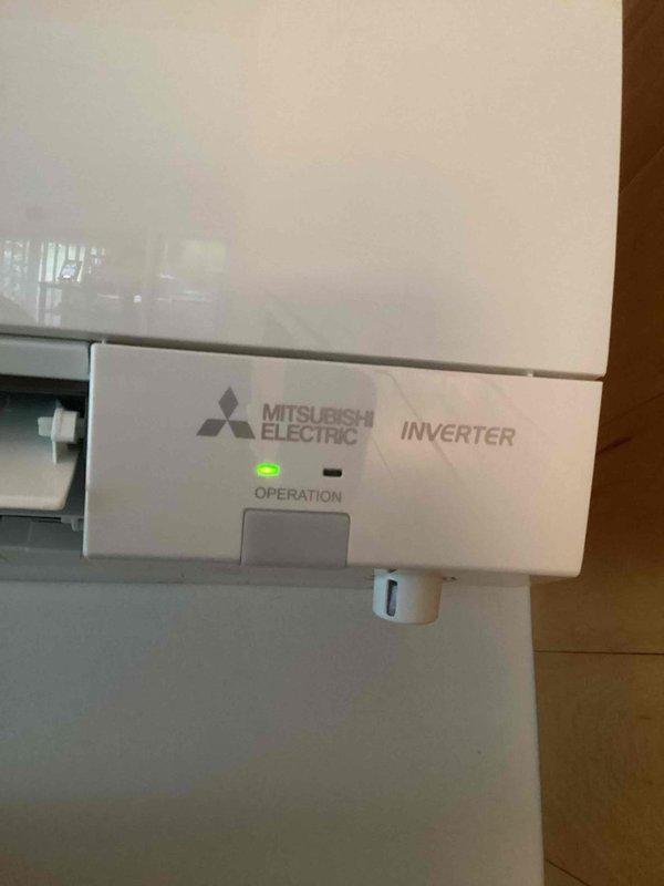 Completed spring maintenance on Mitsubishi Electric inverter mini-split system. Performed comprehensive inspection of indoor and outdoor units, verified system operation with unit showing normal status indicators, and recorded temperature measurements at ductwork reading 49.4°F, confirming proper cooling performance and refrigerant charge levels.