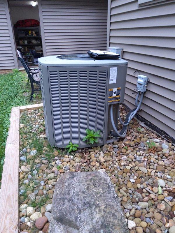 Completed AC retrofit installation at residential property. Installed new outdoor condensing unit with proper refrigerant line connections and electrical disconnect, positioned on rock bed with adequate clearance for airflow and service access. Verified indoor air handler compatibility with existing furnace system in basement mechanical room, confirmed all electrical connections, and ensured proper integration with current HVAC infrastructure.