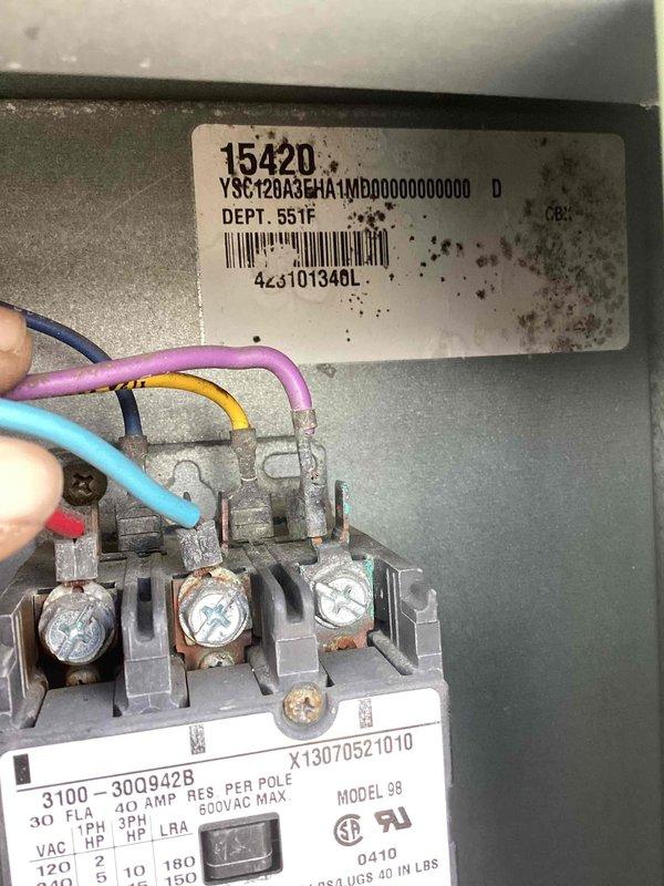 Responded to no cooling complaint in sanctuary area where unit attempted to start but produced clicking and buzzing noise without condenser fan operation. Found disconnect switch in OFF position as customer had de-energized unit. Inspected electrical components, control panel wiring connections, and disconnect box on rooftop unit. Verified proper wire terminations at terminal blocks and examined control board specifications and electrical ratings. Unit tagged and photographed for documentation purposes.