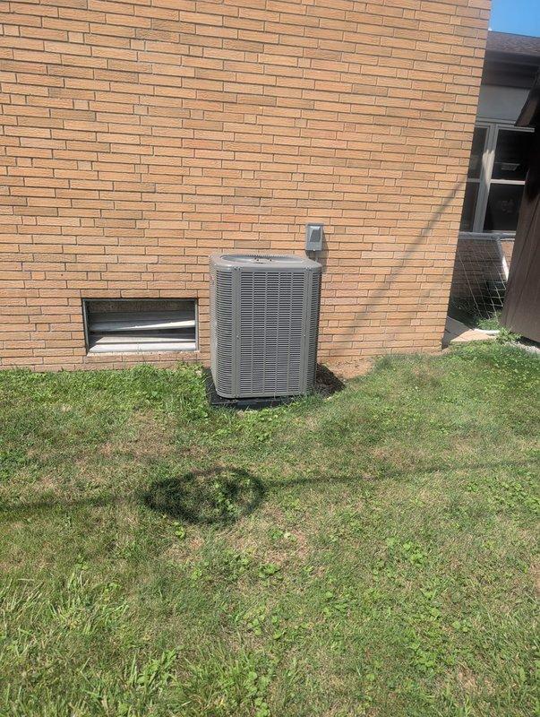 Completed full HVAC system installation on east side of gymnasium facility, including new Lennox furnace and outdoor condensing unit. Installed furnace in interior mechanical space with proper ductwork connections, condensate drainage system via PVC piping, and electrical conduit routing. Mounted exterior AC unit on concrete pad against brick exterior wall with refrigerant line set and electrical disconnect, ensuring proper clearances and secure mounting for commercial application.