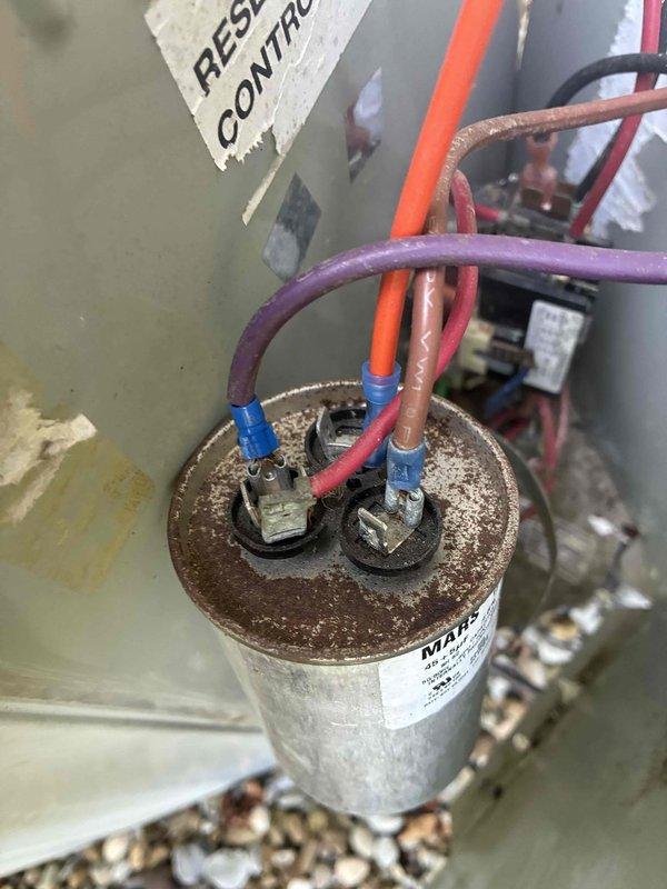 Completed cooling maintenance on two residential HVAC systems per agreement. Inspected outdoor condensing units, tested electrical components including capacitors showing significant corrosion on terminals, and verified proper system operation. All wiring connections were examined and system performance was documented with photos for service records.