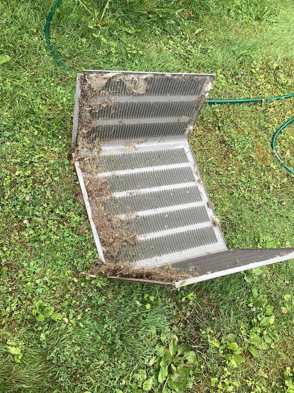 Performed comprehensive air conditioning tune-up service including removal and cleaning of evaporator coil which showed moderate accumulation of dust and debris between fins. Inspected internal components of air handler unit, verified proper drainage system operation, and confirmed all electrical connections and wiring were secure and functioning correctly.