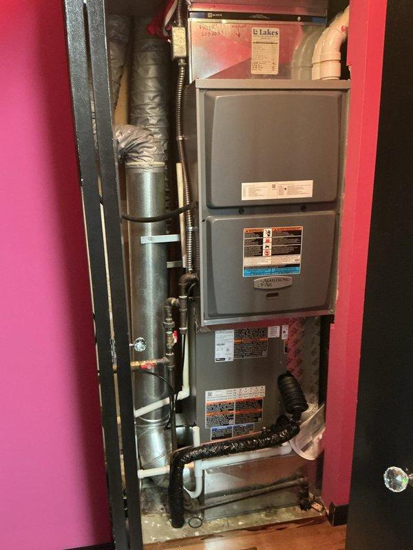 Completed AC retrofit installation in residential utility closet, replacing existing air conditioning system and evaporator coil. Installed new air handler unit with matching evaporator coil in vertical stack configuration above existing furnace. Connected refrigerant lines using copper piping, installed new flex ductwork, and verified all electrical connections to manufacturer specifications. System properly charged with refrigerant according to unit specifications, tested for proper airflow and cooling operation, and confirmed all safety controls functioning correctly.