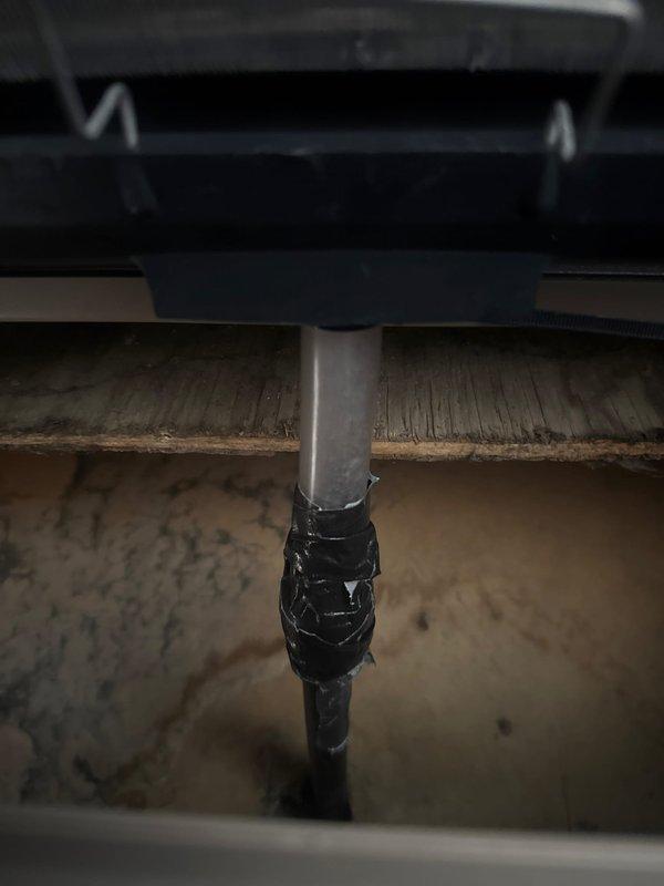 Responded to service call for magic pack unit with disconnected condensate drain line that became detached after filter replacement. Reconnected drain line to proper fitting and secured connection to prevent future disconnection during routine maintenance. Verified proper drainage and system operation upon completion.