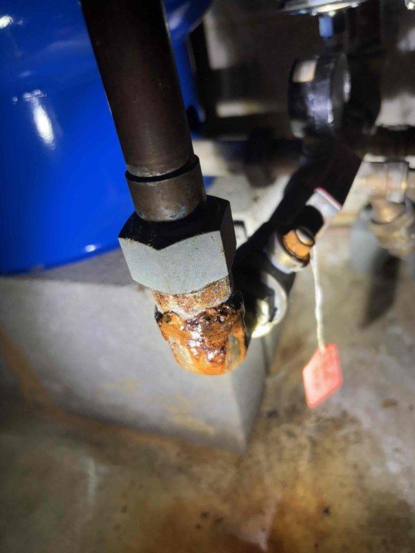 Completed preventive maintenance on 20-year-old air conditioning system. During inspection, discovered severe frost accumulation on refrigerant lines and significant corrosion on pipe fittings, indicating potential refrigerant leak or restricted airflow issues. Documented conditions with photographs for customer review. Customer renewed maintenance plan agreement and payment was collected on-site.
