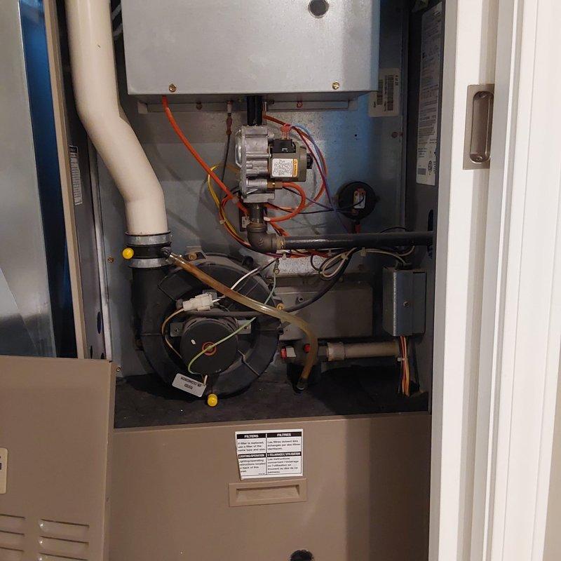 Completed comprehensive HVAC system retrofit involving furnace and air conditioning equipment replacement. Documented existing equipment configuration including gas valve assembly, blower motors, electrical connections, and ductwork plenum system prior to installation of new components. Successfully performed equipment changeout in residential mechanical room with proper integration to existing infrastructure including condensate drainage and ventilation systems.