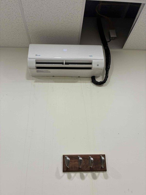 Responded to no cooling complaint on ductless mini-split system. Upon inspection, examined indoor wall-mounted evaporator unit and outdoor condensing unit components including electronic expansion valve and refrigerant lines. System evaluated and restored to proper cooling operation with unit displaying 60°F setpoint.