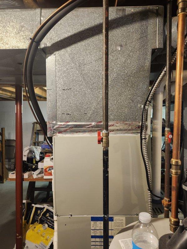 Conducted pre-installation site assessment and measurements for complete HVAC system replacement in residential basement location. Evaluated existing mechanical room layout, documented current equipment placement including water heater positioning, and assessed utility infrastructure including copper plumbing lines, electrical conduits, and available mounting surfaces. Measured ductwork pathways, ceiling clearances with exposed joists, and determined optimal equipment placement for new system installation. Photographed existing conditions showing concrete block walls, basement window location, and current HVAC equipment configuration with associated ductwork and control panel. Verified electrical panel accessibility and confirmed adequate space for new system components. Site preparation measurements completed to ensure proper sizing and efficient installation workflow scheduled for upcoming installation date.
