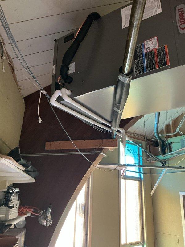 Successfully completed installation of a complete commercial HVAC system consisting of a new air handler unit and air conditioning system. The air handler was mounted in the mechanical room with proper ductwork connections, electrical conduit installation, and secure mounting to structural supports. All equipment was installed per manufacturer specifications with appropriate labeling and documentation affixed to the units.