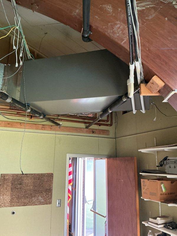 Successfully completed installation of a complete commercial HVAC system consisting of a new air handler unit and air conditioning system. The air handler was mounted in the mechanical room with proper ductwork connections, electrical conduit installation, and secure mounting to structural supports. All equipment was installed per manufacturer specifications with appropriate labeling and documentation affixed to the units.
