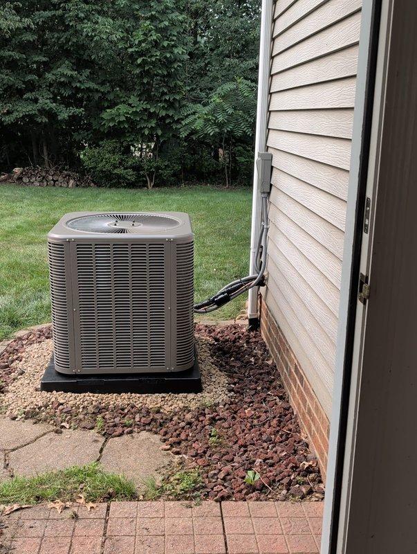 Completed AC retrofit installation including new air conditioning condenser unit and evaporator coil. Installed condenser on concrete pad with proper clearances from structure, mounted unit on vibration-dampening pad, and ran electrical conduit to exterior disconnect. Performed nitrogen pressure test on refrigerant lines which passed with 0.4% pressure drop over 5-minute test period, well within acceptable 0.5% threshold. System achieved stable pressure reading of 302.2 psig, confirming leak-free installation and proper brazing of all refrigerant connections.