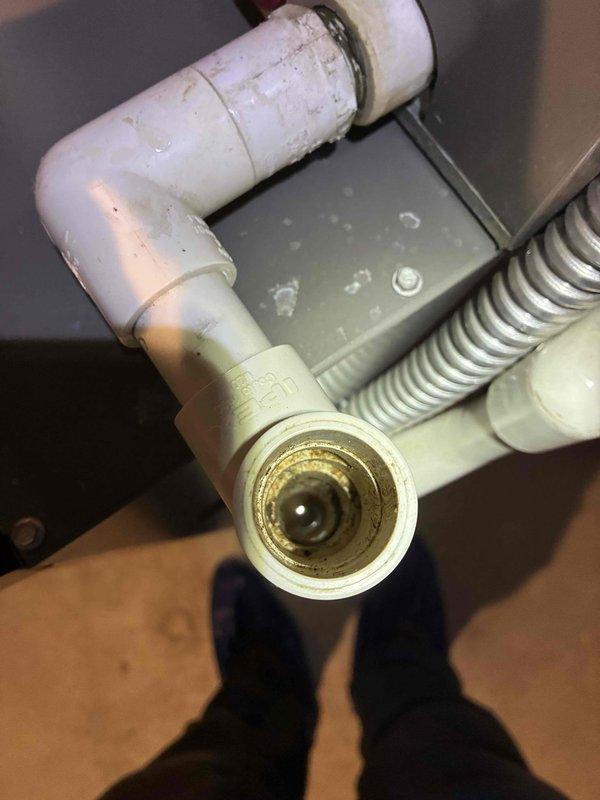 Completed annual cooling maintenance on three 13-year-old air conditioning units. Inspected and evaluated dehumidifier system, noting humidity setpoint configuration at 54% RH with unit operational. Examined condensate drainage system including PVC drain lines and verified proper water removal from equipment.