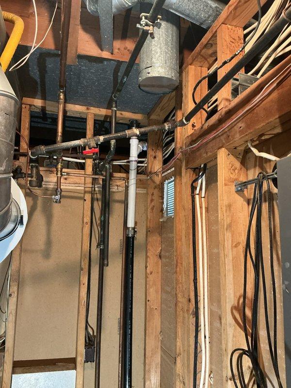 Conducted site assessment of existing gas line servicing outdoor grill connection in basement utility area. Inspected exposed gas piping system, identified termination point requiring cap installation, and provided pricing estimate for proper gas line abandonment per code requirements.