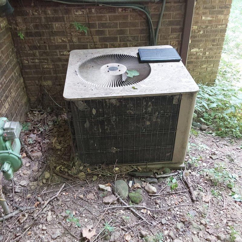 Completed comprehensive AC retrofit installation including replacement of outdoor condenser unit and indoor air handler system. Installed new HVAC equipment in basement utility area with proper ductwork connections, PVC condensate drainage lines with safety valve, and electrical conduit routing. Positioned outdoor condenser unit against exterior brick wall with refrigerant line connections and proper clearances. All components tested and verified operational upon completion of installation.