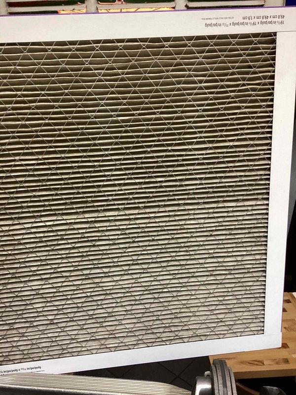 Completed spring maintenance on commercial HVAC system. Inspected and replaced dirty air filter showing significant dust and particulate accumulation. Performed temperature diagnostics using digital measuring instrument at ductwork and insulation areas to verify proper system operation and airflow efficiency.