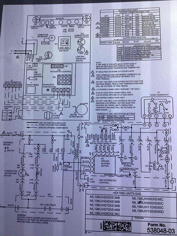Performed diagnostic evaluation on commercial air conditioning system. Measured and recorded temperature readings using digital instrumentation, obtaining reading of 63.3°F at evaporator coil area. Reviewed unit wiring schematic and control sequence for ML196 series heating unit to verify proper electrical connections and safety device integration including flame rollout switch, pressure switches, and integrated furnace control board.