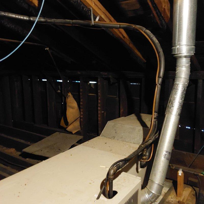 Completed comprehensive site assessment for commercial AC retrofit project. Evaluated existing rooftop HVAC unit and associated ductwork system, including metallic supply duct routing through attic space and flexible ductwork connections. Documented current equipment configuration, electrical conduit pathways, and rooftop mounting conditions to develop replacement specifications for aging commercial air conditioning system.