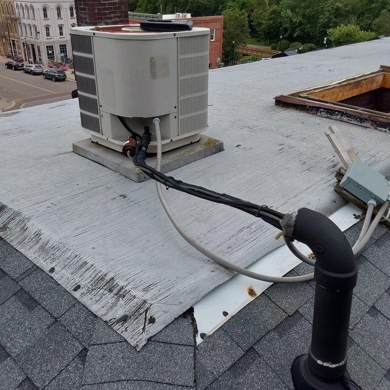 Completed comprehensive site assessment for commercial AC retrofit project. Evaluated existing rooftop HVAC unit and associated ductwork system, including metallic supply duct routing through attic space and flexible ductwork connections. Documented current equipment configuration, electrical conduit pathways, and rooftop mounting conditions to develop replacement specifications for aging commercial air conditioning system.