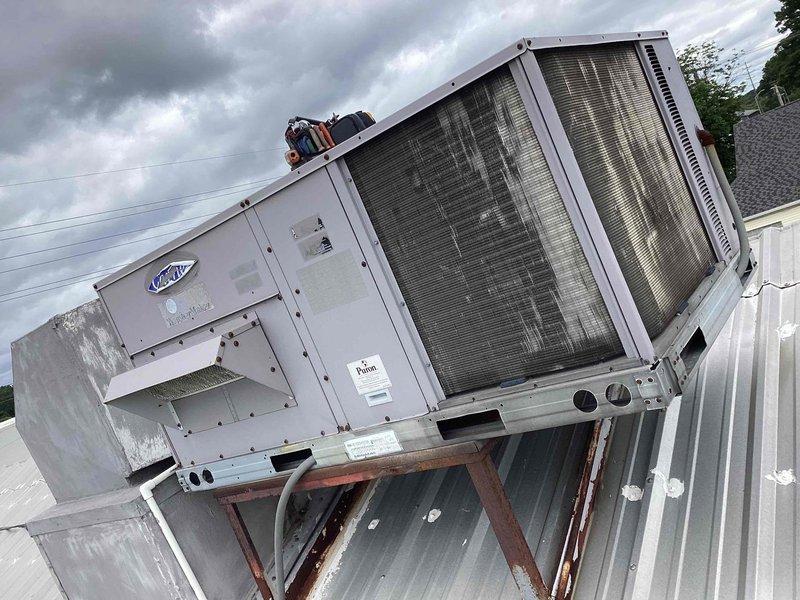 Performed scheduled cooling maintenance on commercial rooftop HVAC unit. Inspected condenser coils, control panels, and unit housing, noting weathering and corrosion on support structure. Replaced 16x25x2 MERV-rated air filter and verified proper system operation upon completion.