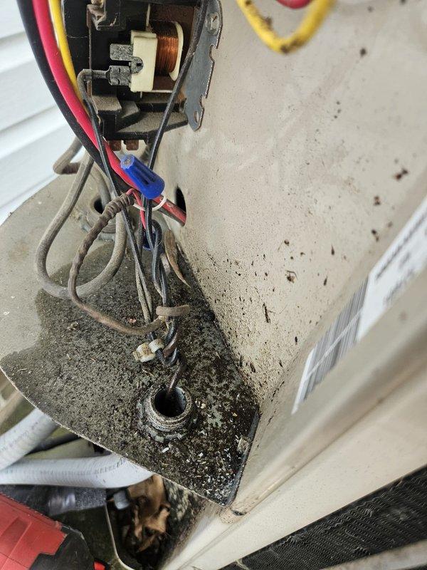 # HVAC Service Call - No Cooling Issue

Responded to service call for 22-year-old air conditioning unit with no cooling complaint. Upon arrival, performed system diagnostic to identify cause of failure.

Inspected outdoor condensing unit and found failed dual run capacitor preventing compressor and condenser fan motor operation. Capacitor showed visible signs of deterioration and tested out of specification range using multimeter. This is a common failure point on units of this age due to normal wear and extended service life.

Removed defective capacitor from mounting bracket and disconnected all electrical connections including common, compressor, fan, and HERM terminals. Installed new dual run capacitor with proper microfarad rating matching manufacturer specifications for the equipment. Reconnected all electrical wiring to appropriate terminals ensuring proper color coding and secure connections.

Restored power to unit and verified compressor and condenser fan motor startup. Monit