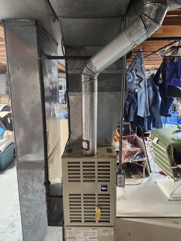 Completed full HVAC system retrofit in basement utility area, including installation of new furnace unit and air conditioning components. Installed new ductwork with proper insulation, configured exhaust venting with metallic piping, and ensured all connections meet code requirements. System tested and operational upon completion.