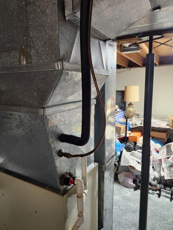 Completed full HVAC system retrofit in basement utility area, including installation of new furnace unit and air conditioning components. Installed new ductwork with proper insulation, configured exhaust venting with metallic piping, and ensured all connections meet code requirements. System tested and operational upon completion.