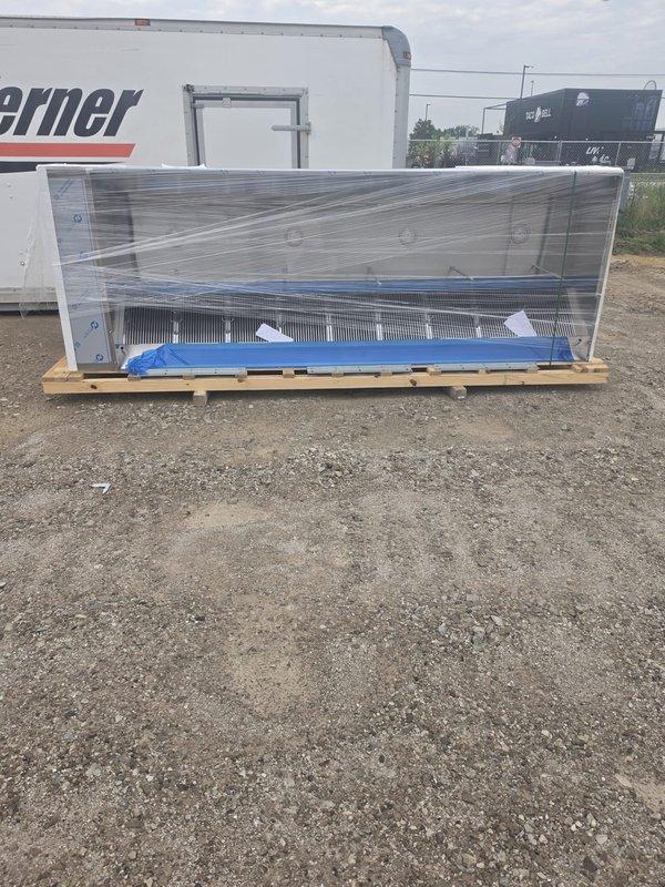 Attended bi-weekly site and safety meeting for commercial new construction project. Documented equipment delivery and staging, including packaged HVAC unit with protective wrapping on pallet and spiral ductwork components with proper labeling and securing. All materials appeared in good condition and ready for installation phase.